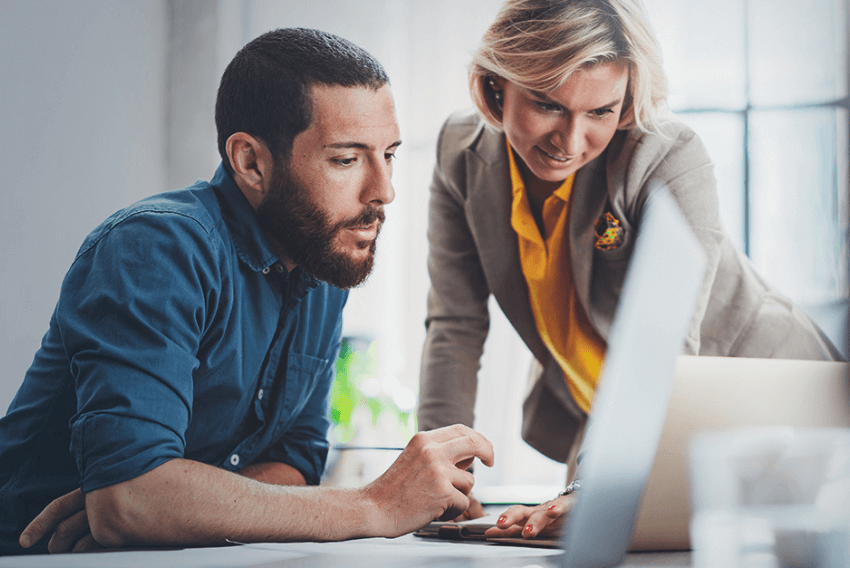 A man and woman discussing how inflation impacts accounting and finance teams.