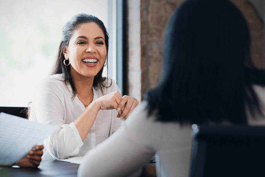 A female talent aquisition (TA) solutions partner supports an in-house recruiting team.
