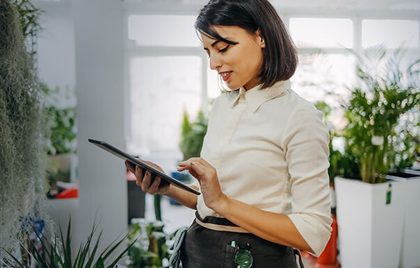 A woman utilizing artificial intelligence (AI) in the customer service industry.