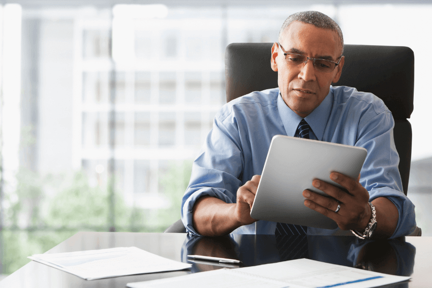 A male CFO looking over finance transformation initiatives.