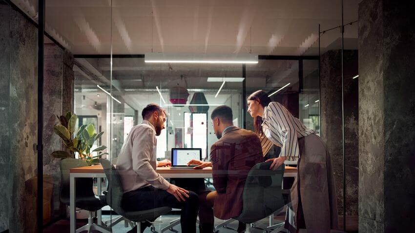 Group of professionals workforce planning to reduce month-end close stress.