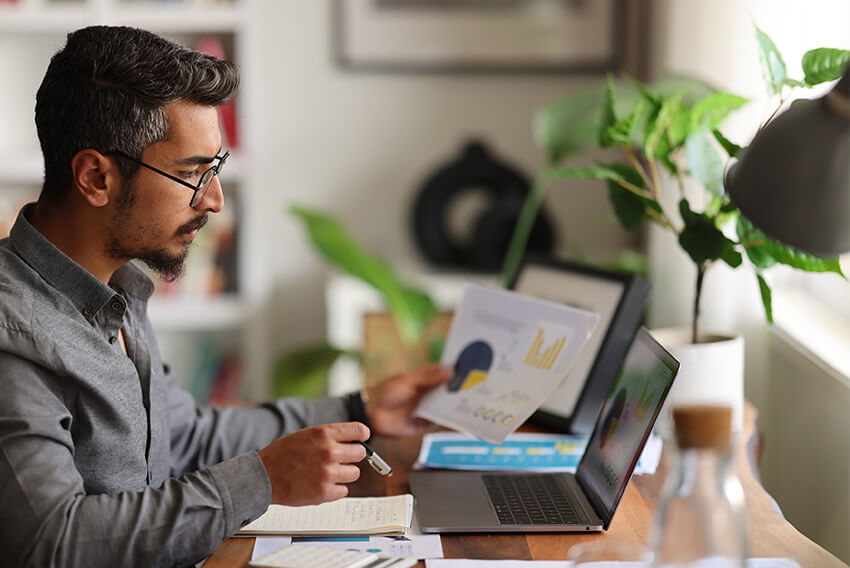 A male accounting professional being proactive and learning how contract talent can mitigate the effects of tariffs.