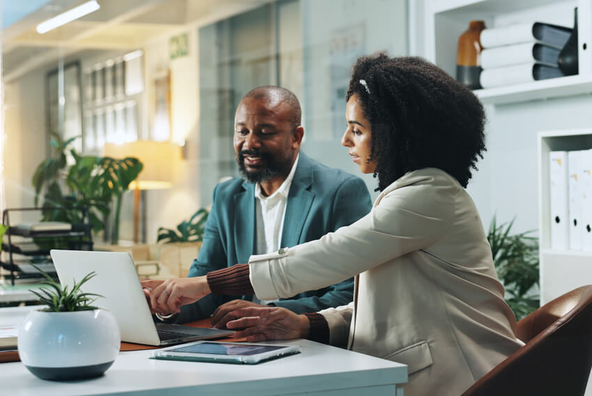 Two professionals exploring the top 5 accounting and finance trends for 2026 that will shape the finance and accounting workforce.