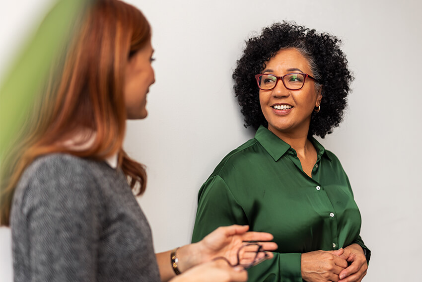 Two professionals discussing the latest trends driving job growth in 2026.