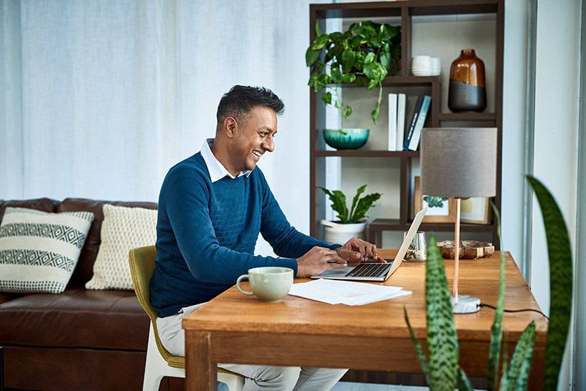 Person sitting a desk on the computer