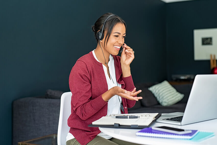 A woman supporting Know YourAgent (KYA) compliance efforts with managed solutions.